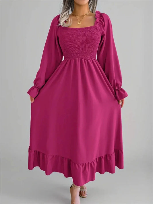 Roselle Midi Dress in bold magenta with smocked bodice and ruffled neckline, ideal for weddings and formal events.
