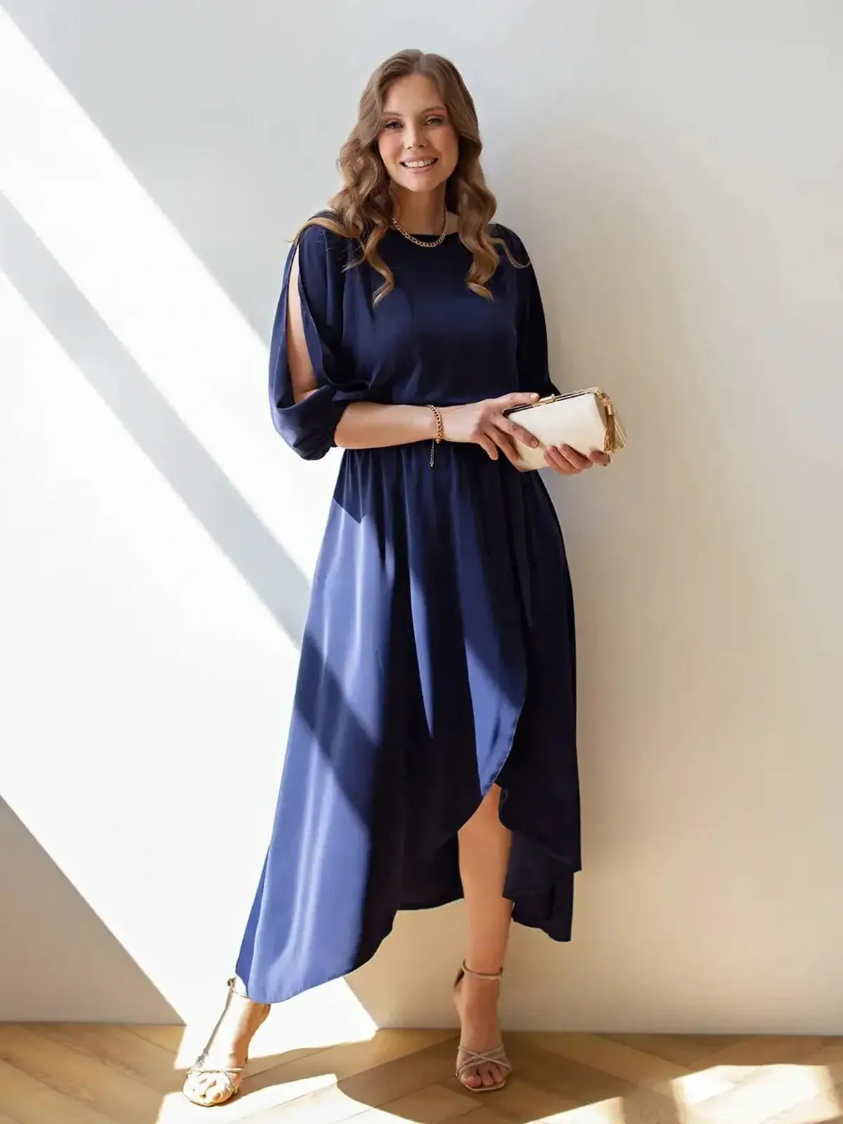 Elegant navy Midi dress with cutouts, perfect for weddings and formal occasions, showcasing fluid silhouette and stylish design.