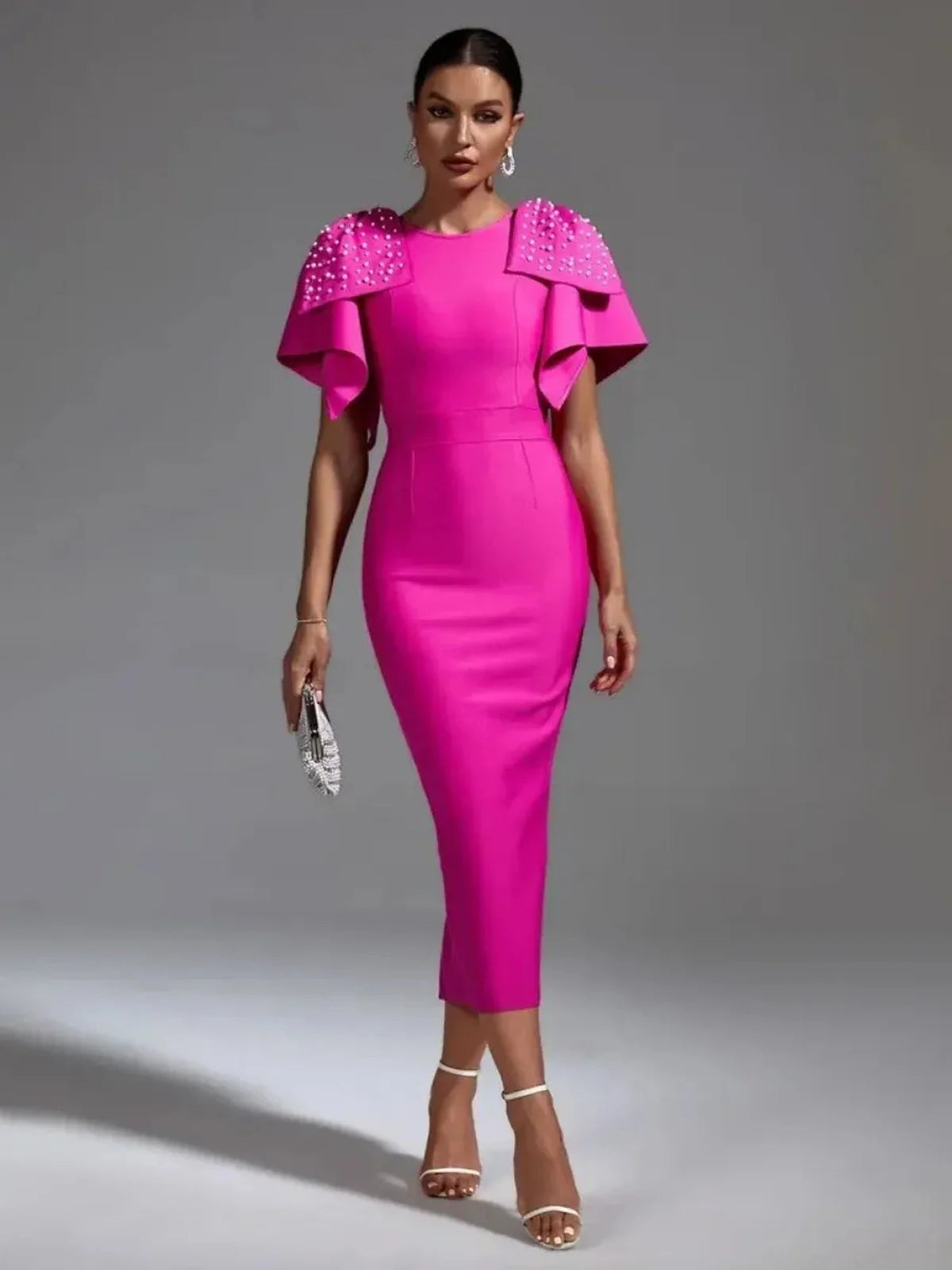 Bold fuchsia Pearl Cape Midi Dress with sculpted shoulders and pearl embellishments, ideal for weddings and formal events.