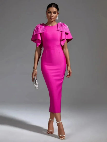 Bold fuchsia Pearl Cape Midi Dress with sculpted shoulders and pearl embellishments, ideal for weddings and formal events.