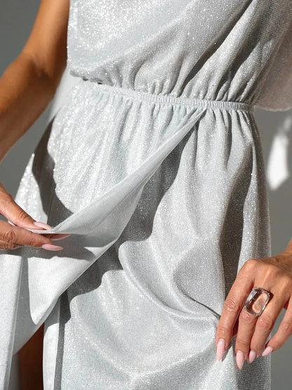 Close-up of the Celestial Glow Midi Dress showcasing shimmering fabric and an elastic waist, perfect for summer and wedding guest attire.
