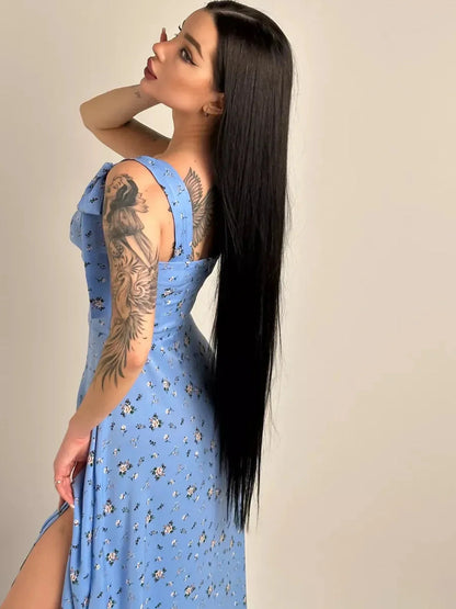 Elegant floral charm midi dress in soft blue with shoulder ties and side slit, perfect for summer events.