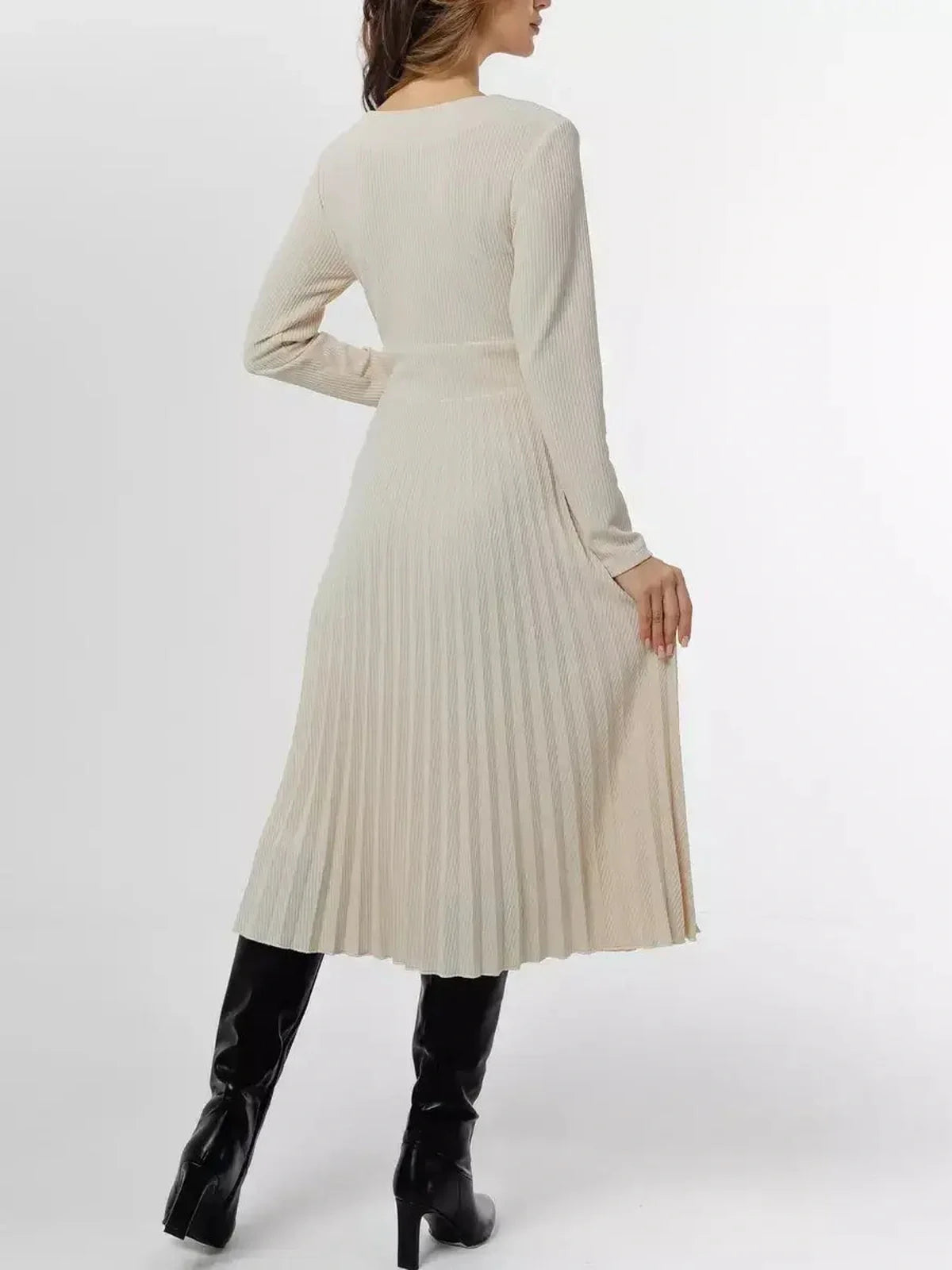 Back view of the Ivory Grace Midi Dress showcasing pleats, long sleeves, and a feminine silhouette in ivory.