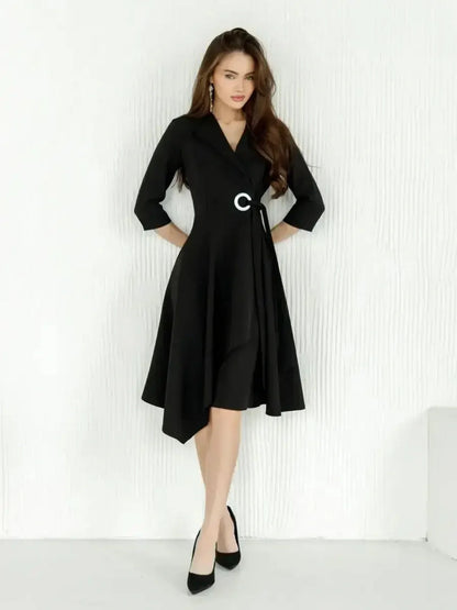 Elegant black wrap midi dress with asymmetric hem and cinched waist, perfect for weddings and formal events.