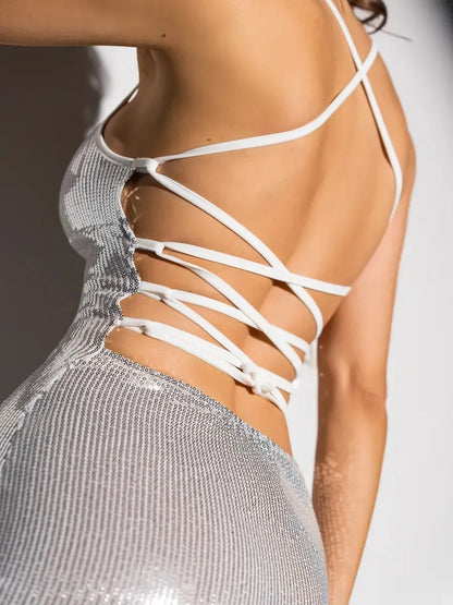 Close-up of the Lustre Midi Dress showcasing its strappy back design and shimmering sequin finish, perfect for weddings.