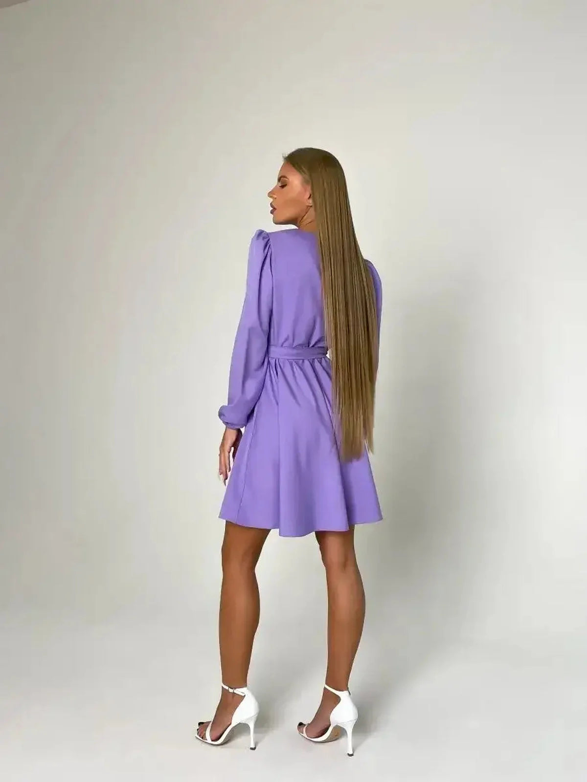 Elegant lavender mini dress, perfect for weddings and special occasions, featuring a cinched waist and long sleeves.