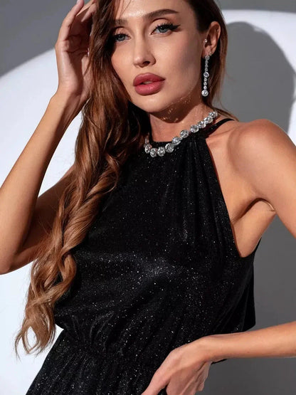 Model showcasing the Noir Halo Midi Dress, a shimmering black dress with a high neck and glimmering detailing.