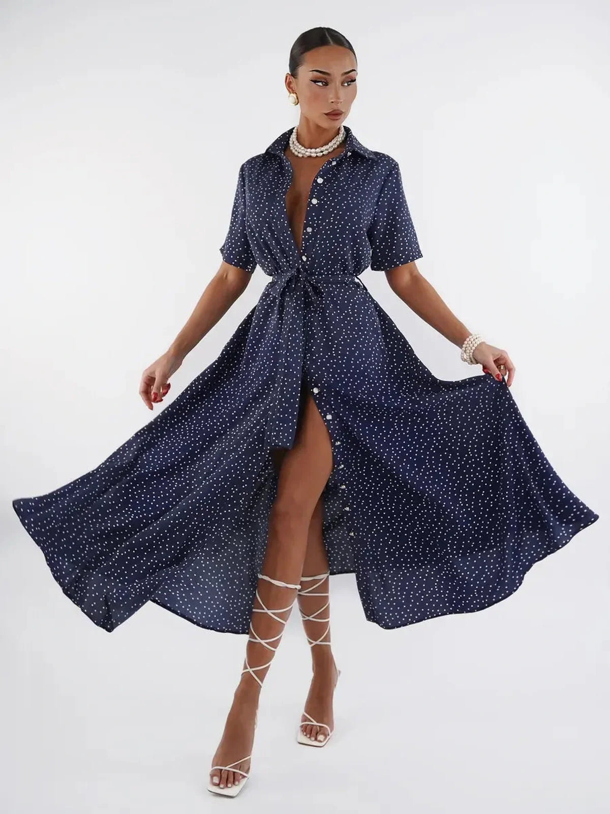 Midnight Dot Midi Dress in navy with white polka dots, featuring a button-down front and flowy silhouette, perfect for any occasion.