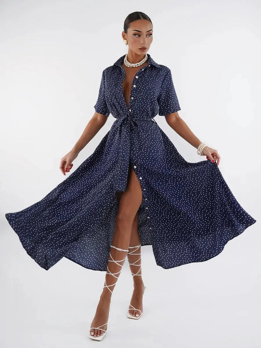 Midnight Dot Midi Dress in navy with white polka dots, featuring a button-down front and flowy silhouette, perfect for any occasion.