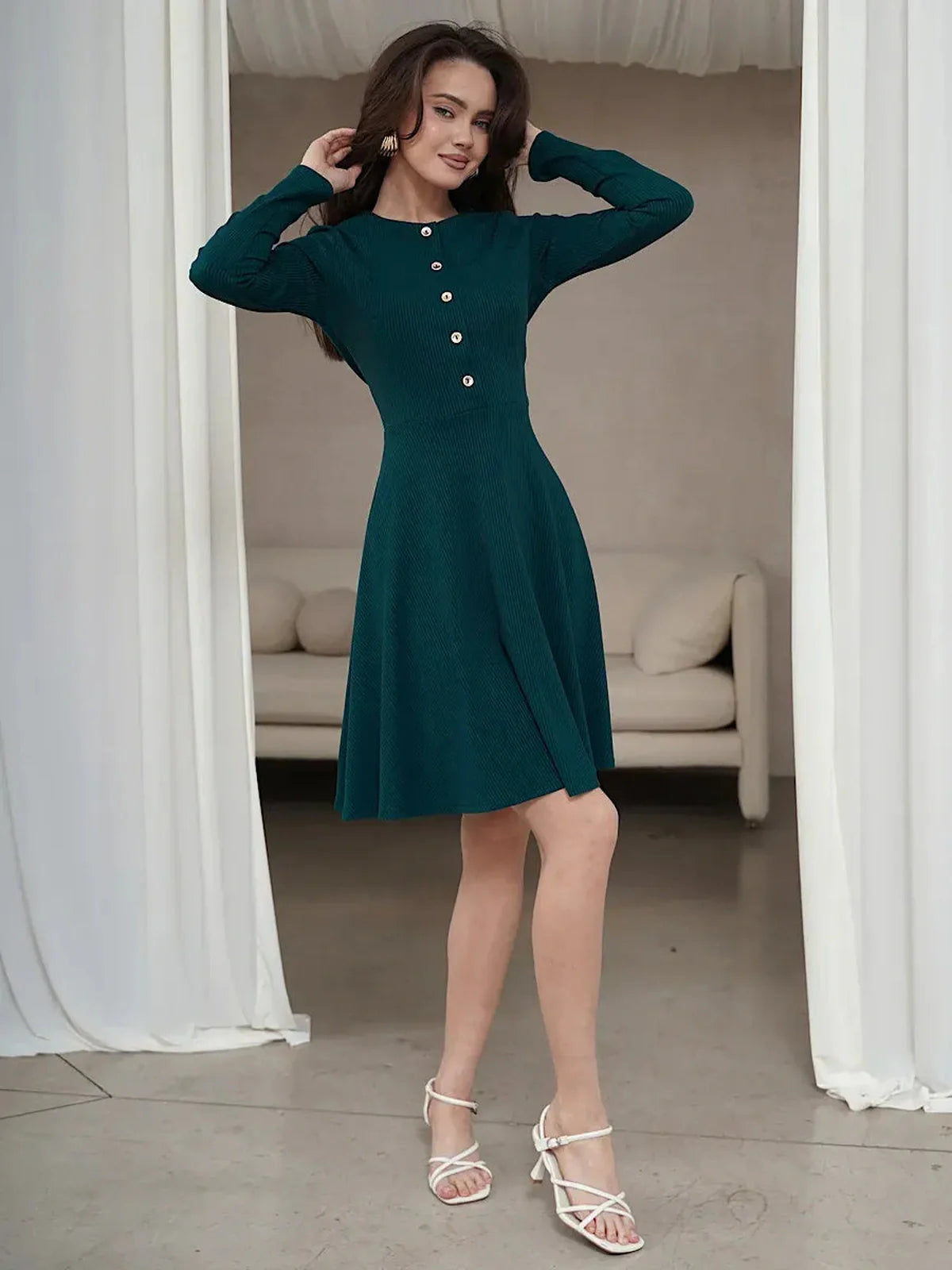 Emerald Line mini dress in elegant green, featuring long sleeves, button placket, and flared skirt, perfect for weddings and events.