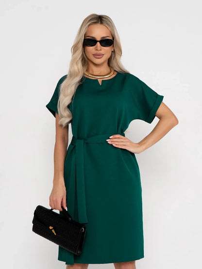 Emerald Mode green mini dress with short sleeves, notched neckline, and fabric belt, perfect for summer and formal occasions.
