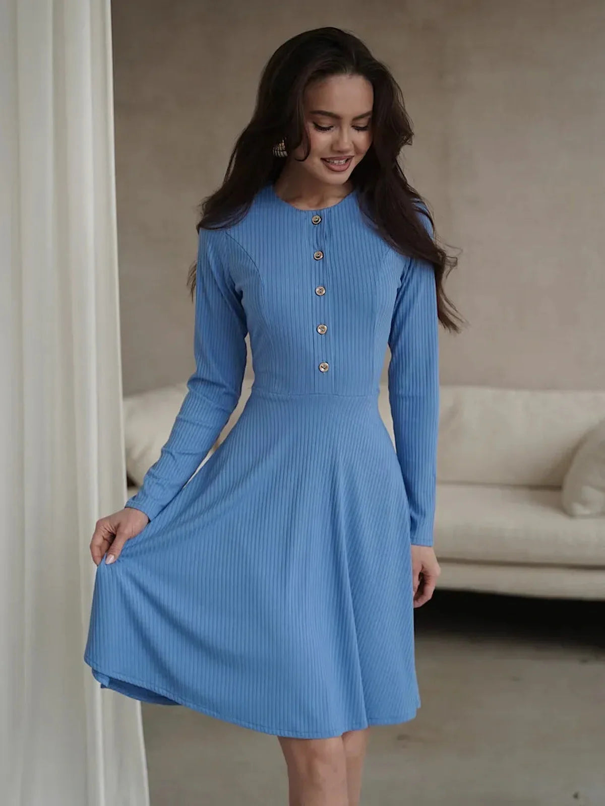 Soft sky-blue mini dress with long sleeves and front button placket, perfect for weddings and summer events.