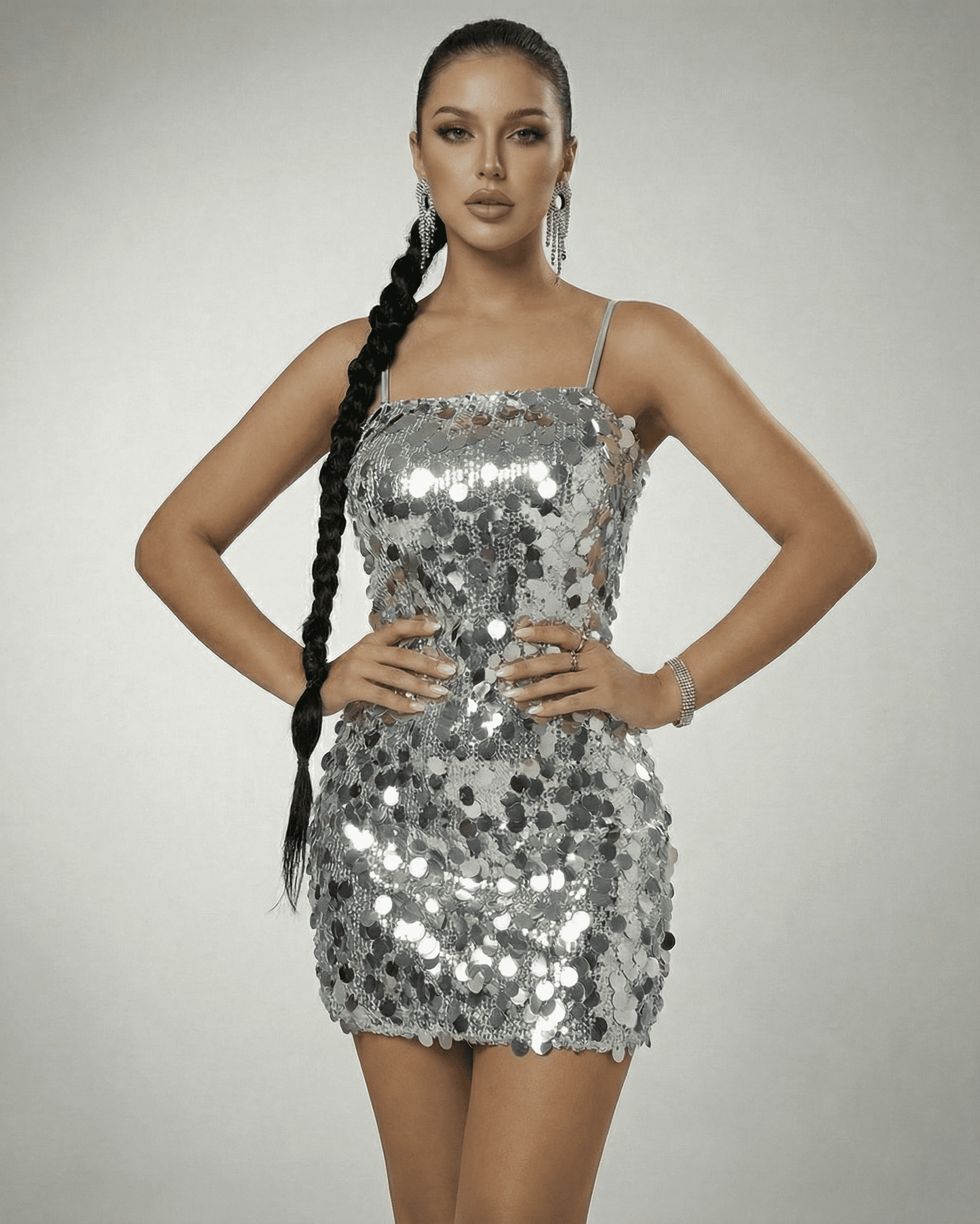 Stella Mini Dress by Slimona, silver sequin off-the-shoulder mini dress showcasing a high-waist silhouette.