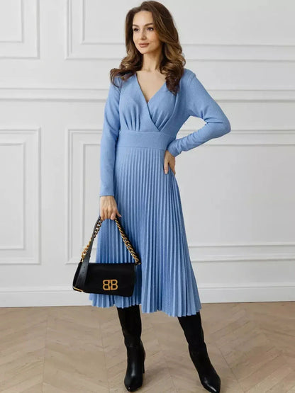 Celeste Midi Dress in sky blue, featuring elegant pleats, V-neckline, and flowy skirt, ideal for weddings or formal events.
