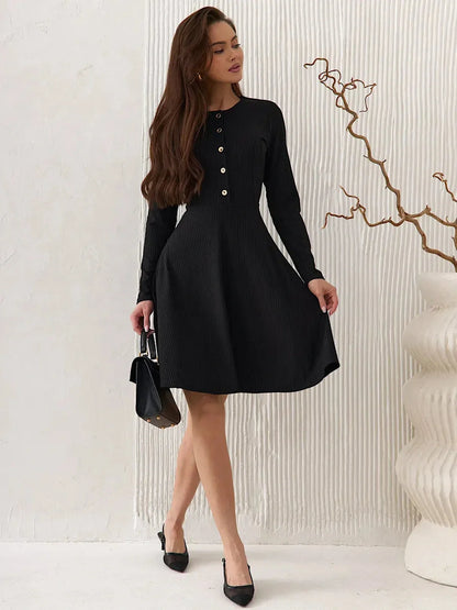 Elegant Mod Noir black mini dress with long sleeves and button detailing, perfect for weddings and special occasions.