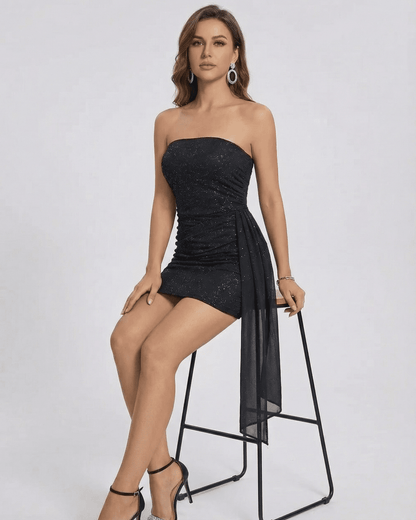Nocturne Mini Dress by Slimona, strapless high-waist mini dress with draped panel in black.