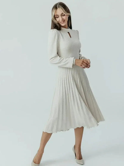 Grace Pleat Midi Dress in soft ribbed knit with flared pleated skirt and keyhole cutout, perfect for weddings and formal events.