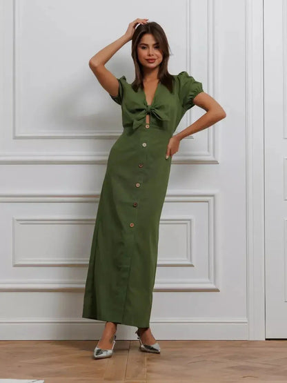 Olive Whisper Maxi Dress featuring puff sleeves and tie front, perfect for weddings or casual outings.