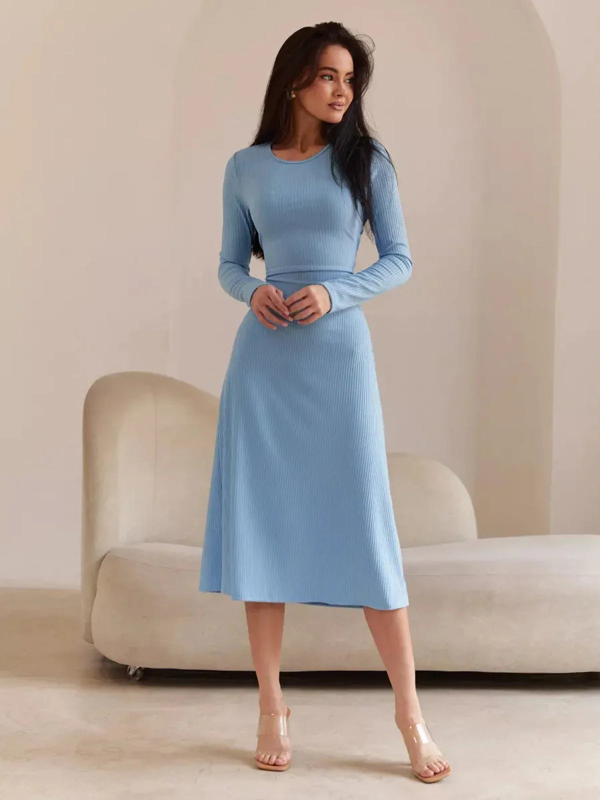 Sculpted Grace Midi Dress in soft blue, featuring long sleeves and a flattering silhouette, perfect for summer weddings and formal events.
