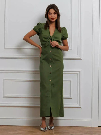 Olive Whisper Maxi Dress featuring puff sleeves, tie front, and elegant khaki design, perfect for summer weddings or special occasions.