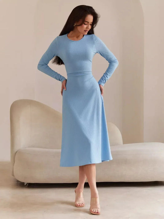Sculpted Grace Midi Dress in soft blue, featuring long sleeves, a fitted silhouette, and a midi-length hemline.