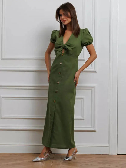 Olive Whisper Maxi Dress featuring puff sleeves and tie front, perfect for summer weddings and special occasions.