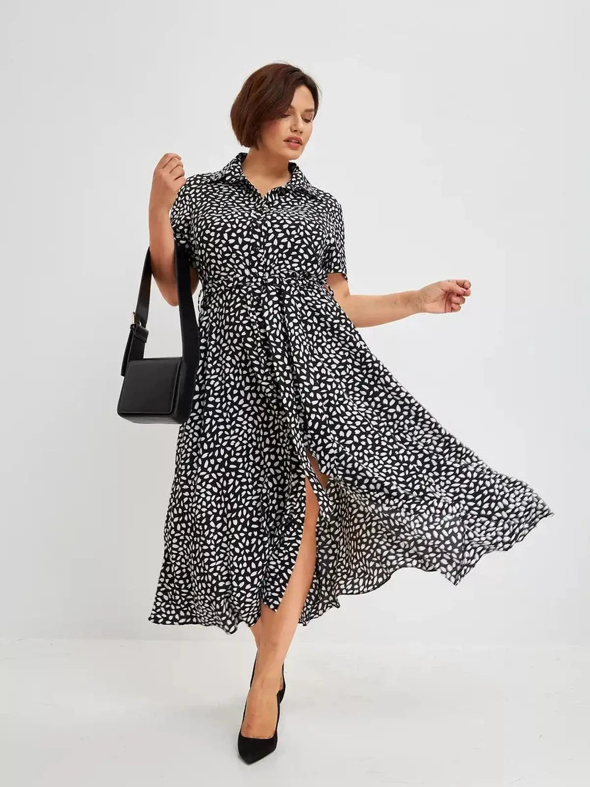 Monaco Midi Dress in black and white print, perfect for summer weddings, casual outings, and stylish everyday wear.