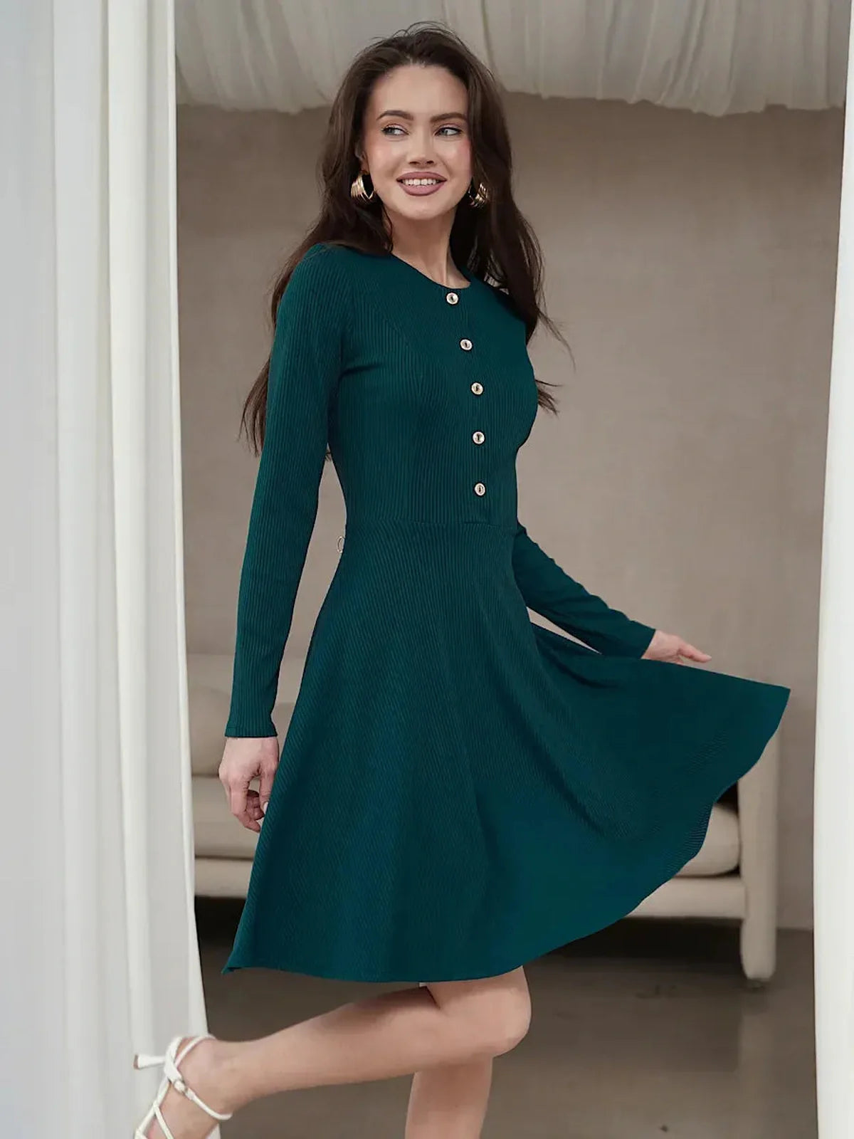 Emerald mini dress with long sleeves and button placket, perfect for weddings and formal occasions.