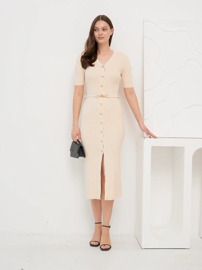 Model wearing Pearl Knit Midi Dress with V-neckline and split hem, ideal for weddings and formal occasions.