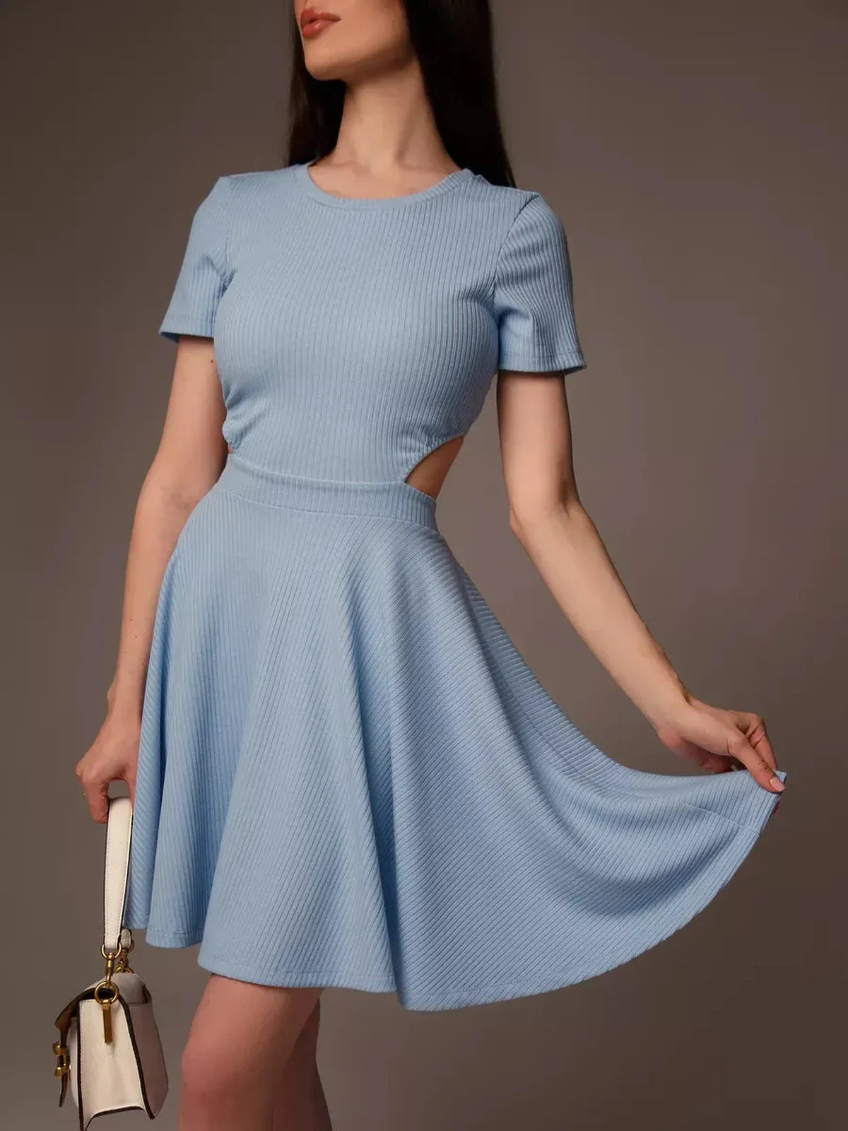 Stylish blue mini dress with cut-out waist, perfect for summer brunches and beachside events.