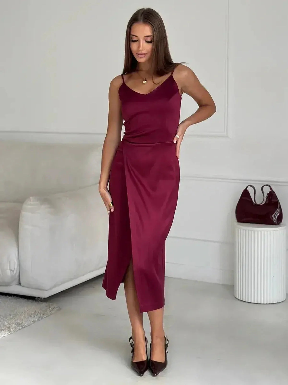 Crimson Luxe Midi Dress in burgundy satin with wrap design and side slit, ideal for formal events or weddings.