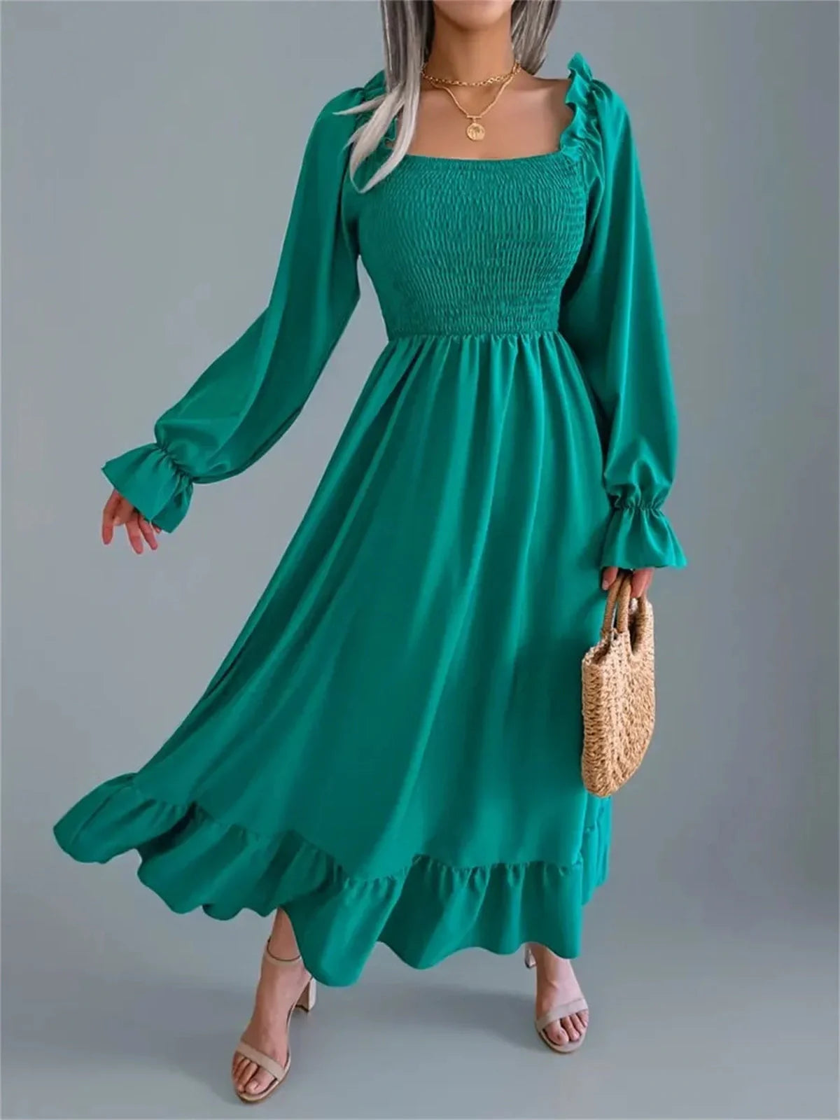 Meadow Ruffle Midi Dress in rich green with long sleeves, smocked bodice, and flowing skirt, perfect for weddings and special occasions.