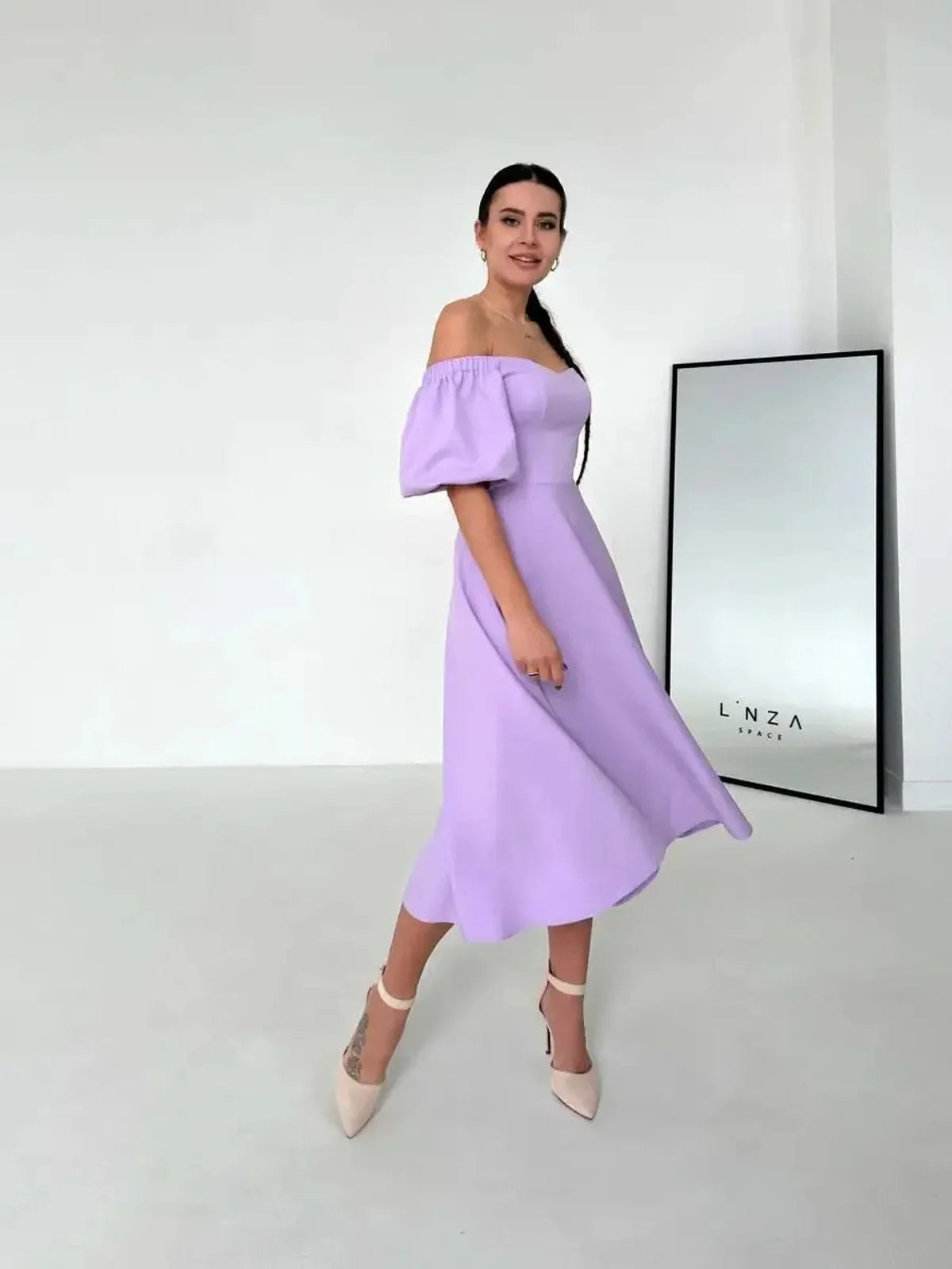 Lilac Grace Midi Dress featuring off-shoulder puff sleeves, ideal for weddings, summer parties, and elegant occasions.