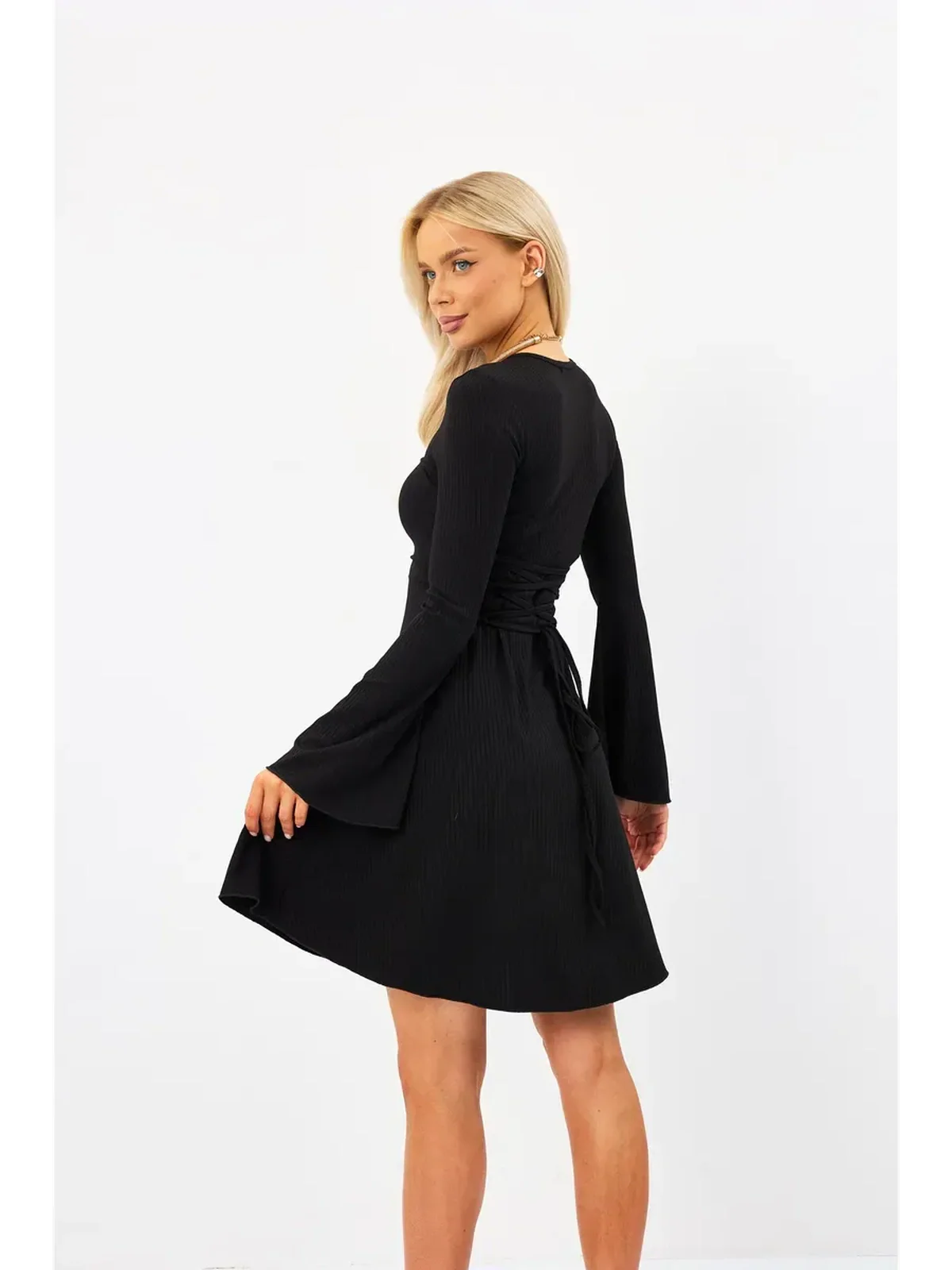 Elegant black flare mini dress with fluted sleeves and adjustable lace-up back, perfect for chic summer occasions.