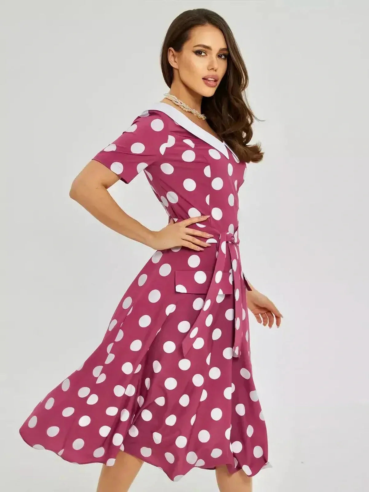 Retro dot midi dress with bold polka dots and an elegant white collar, perfect for summer parties and casual styling.