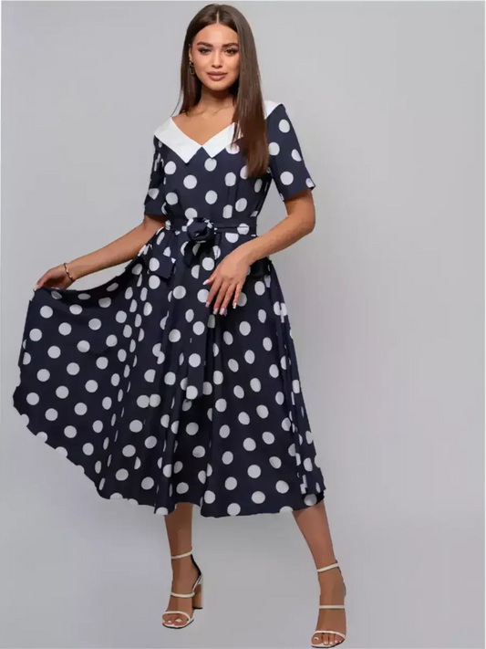 Nautical Charm Midi Dress featuring classic polka dots, a white collar, and a flared silhouette perfect for summer events.
