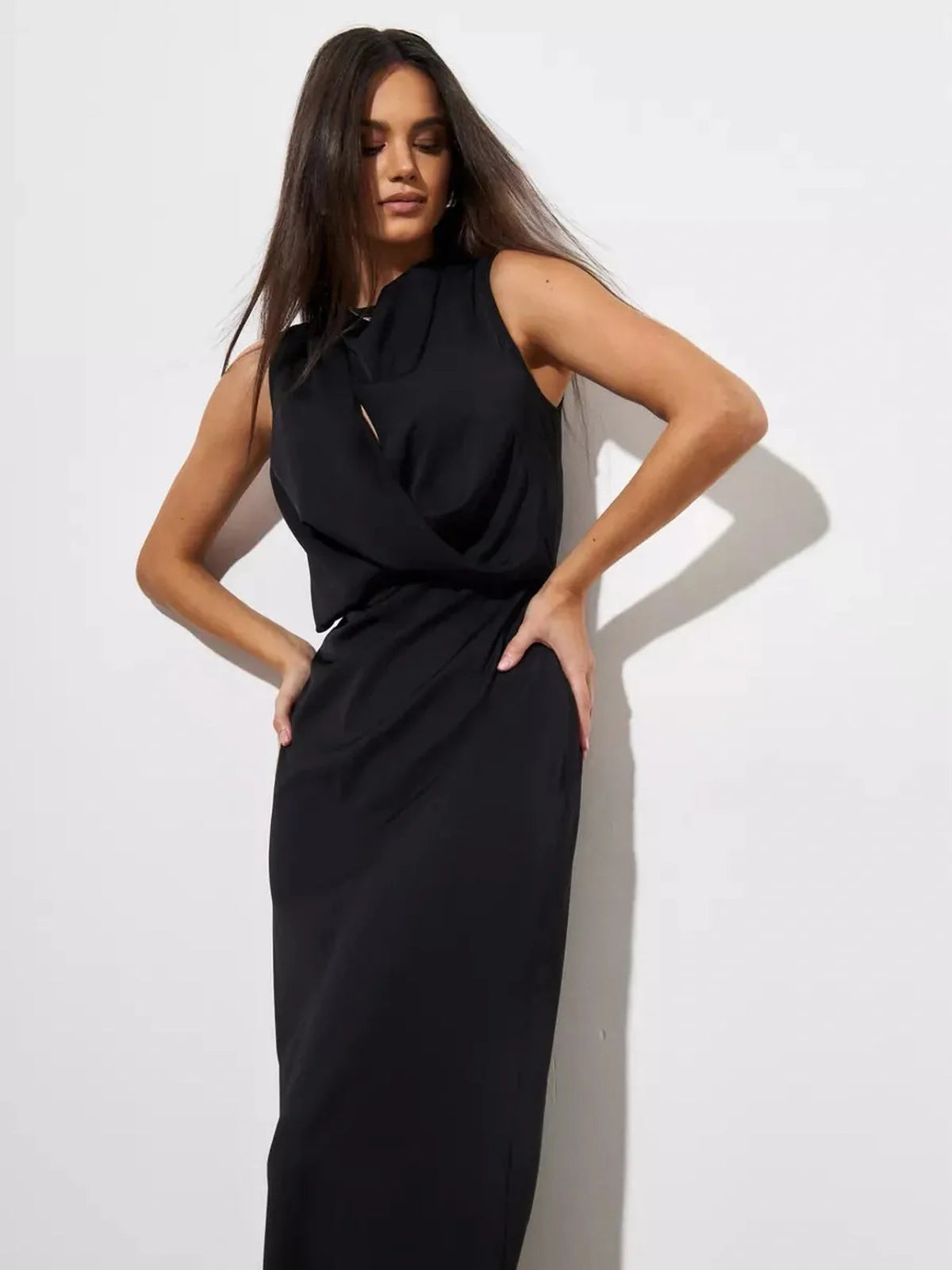Noir Drape Maxi Dress in black, featuring an artfully gathered neckline and sleek silhouette, ideal for formal occasions.