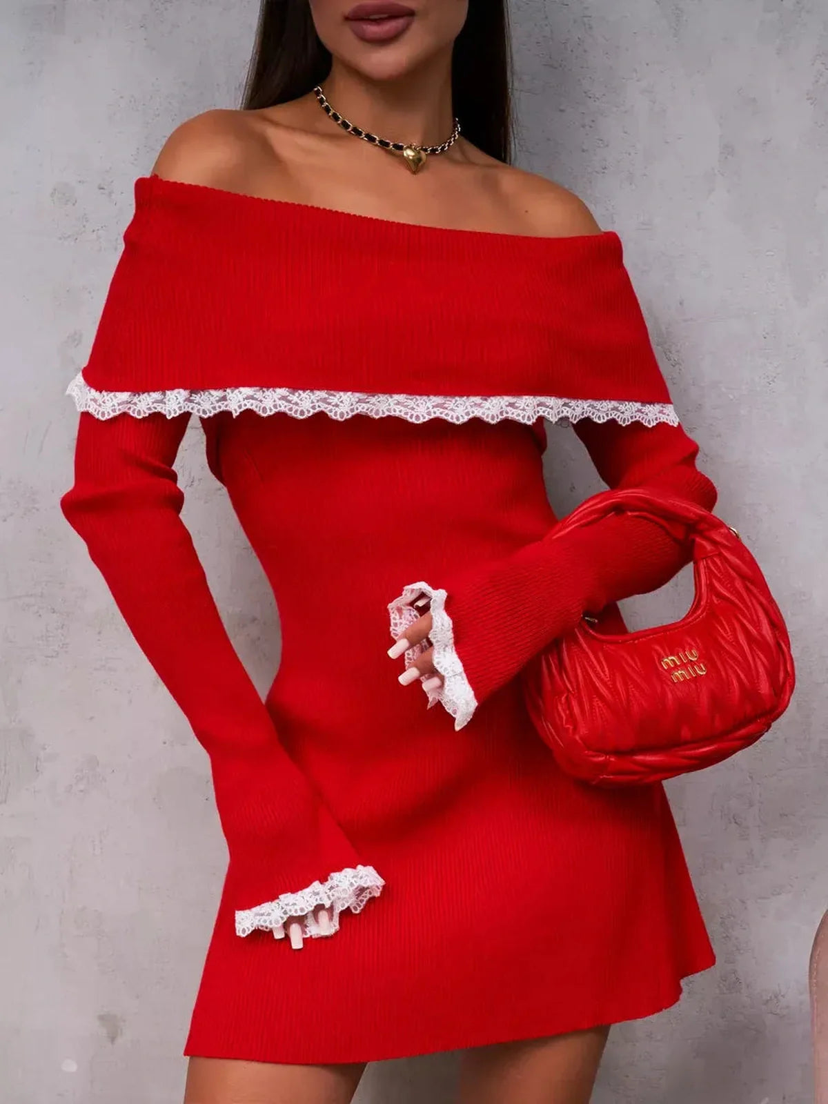 Off-shoulder red mini dress with lace trim, paired with a chic handbag, perfect for summer parties or cocktail events.