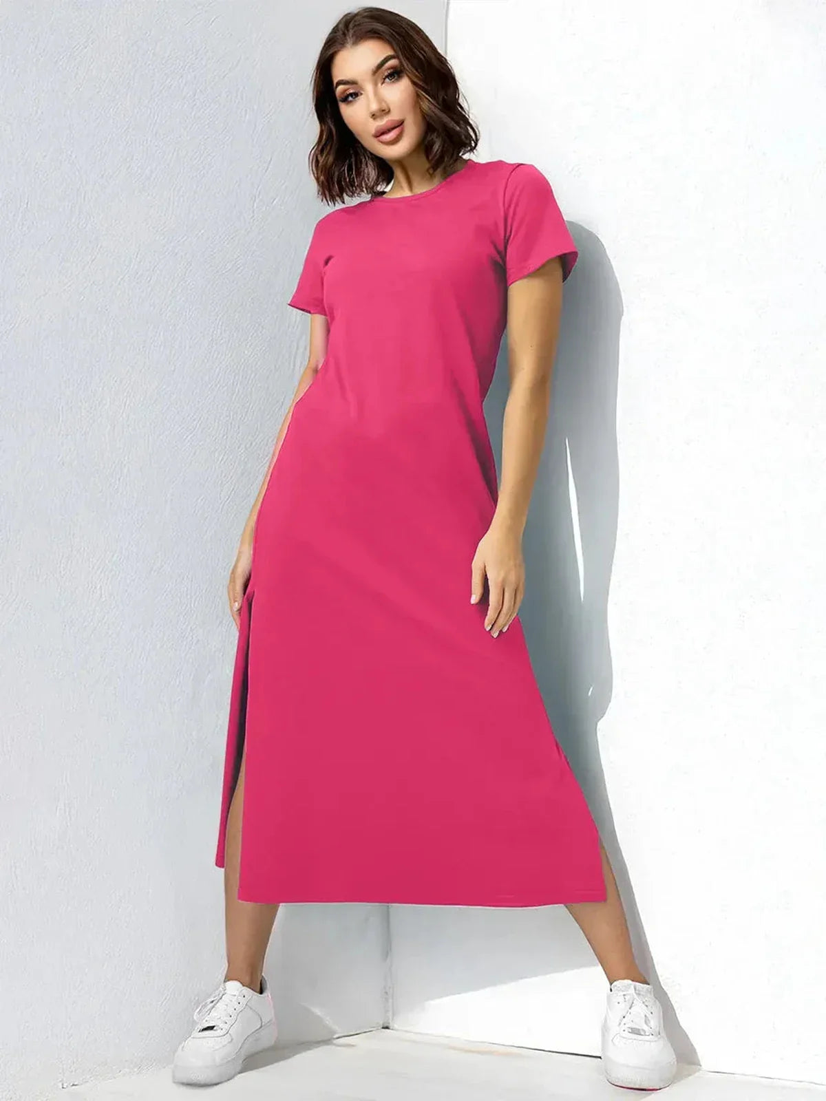 Breeze Midi Dress in vibrant raspberry-pink, featuring side slits and short sleeves, perfect for summer and casual events.