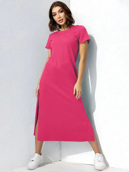 Breeze Midi Dress in vibrant raspberry-pink, featuring side slits and short sleeves, perfect for summer and casual events.