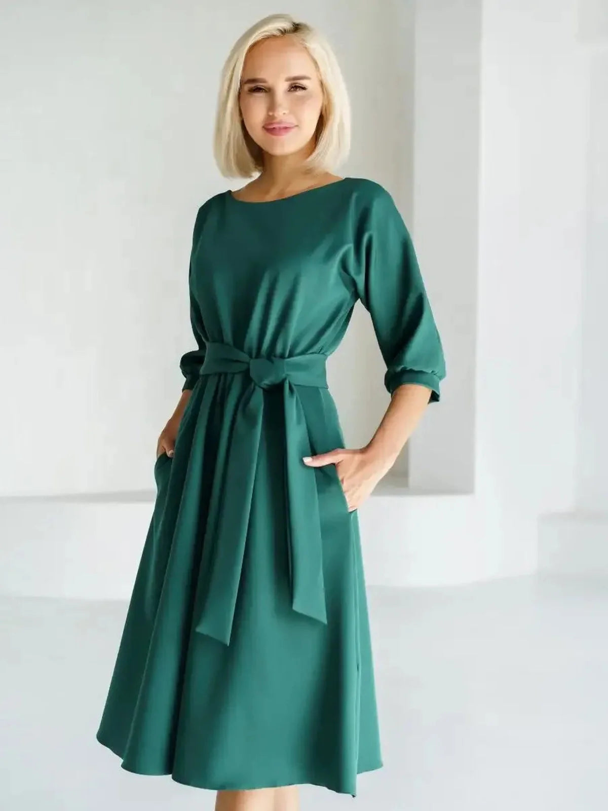 Emerald Aura Midi Dress featuring a belted waist, fluid A-line silhouette, ideal for weddings, parties, and summer events.