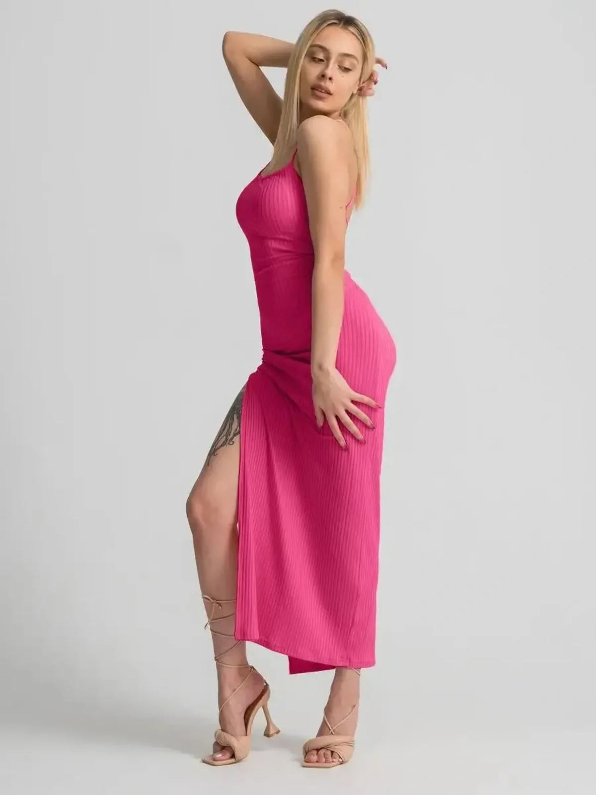 Model wearing a pink Lush Lace Midi Dress with side slit, showcasing a stylish and feminine look for summer events.