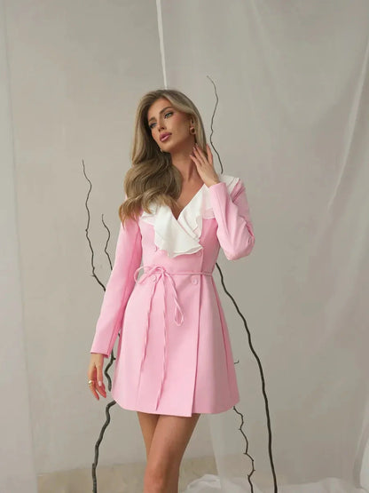 Rose Cascade mini dress in blush pink with white ruffle neckline, perfect for weddings and summer events.