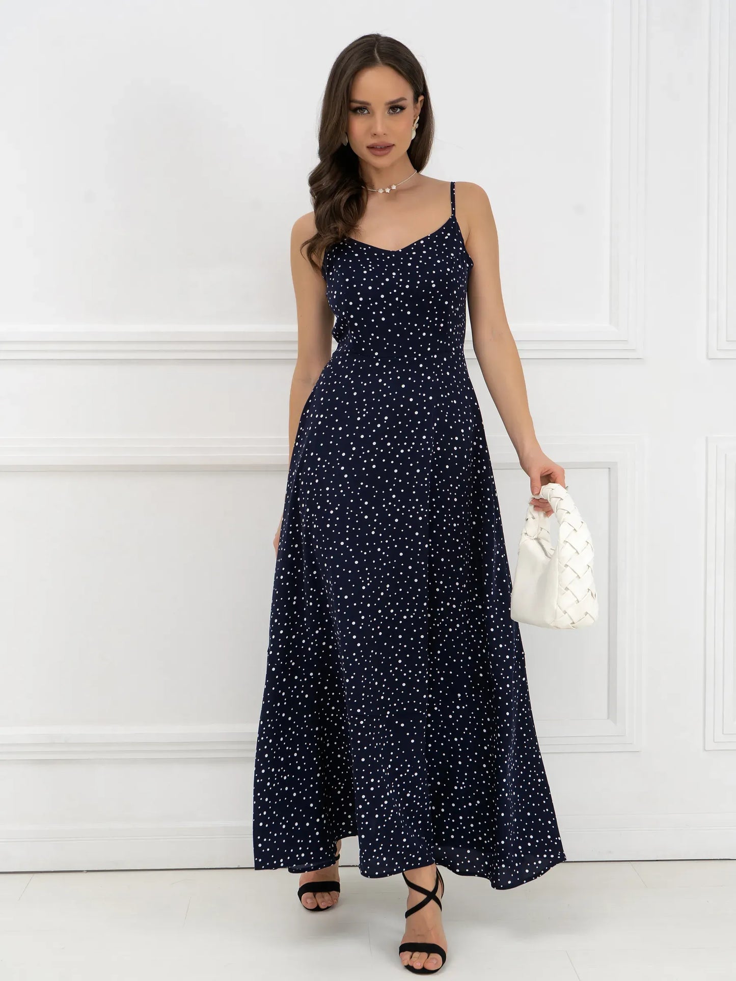Elegant Noir Dots Maxi Dress featuring a flattering A-line silhouette and micro-polka dots, perfect for summer occasions.