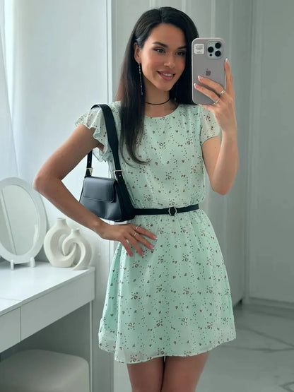 Mint Glow Mini Dress in delicate mint chiffon with flutter sleeves and cinched waist, perfect for summer parties.