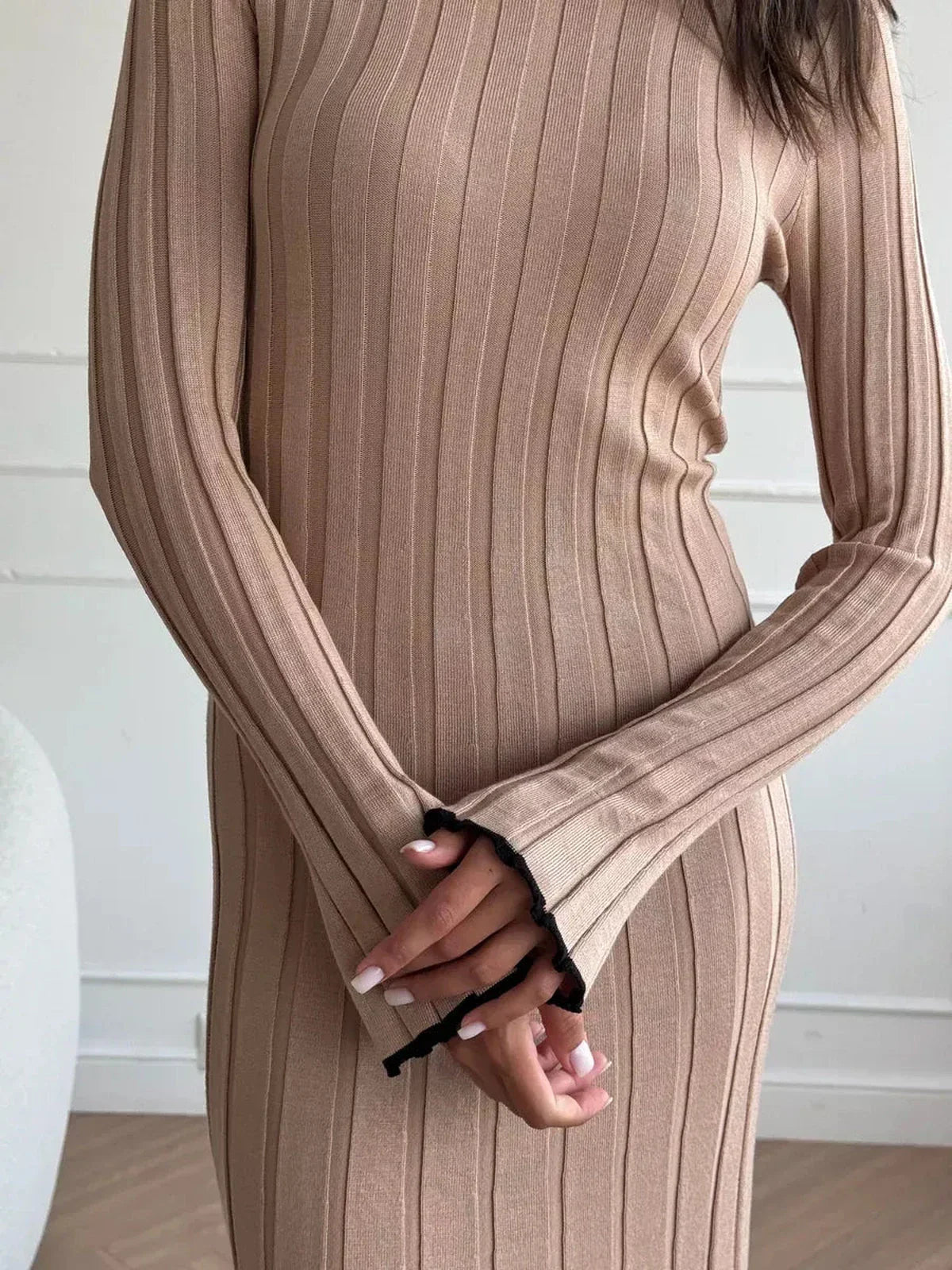 Sahara Curve Maxi Dress in sandstone beige, featuring soft ribbed texture and elegant full-length cut.