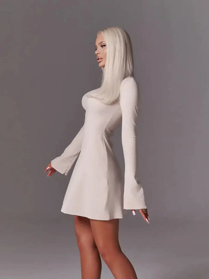 Ivory flare mini dress with bell sleeves, featuring a sleek fit and modern minimalism for wedding or cocktail events.