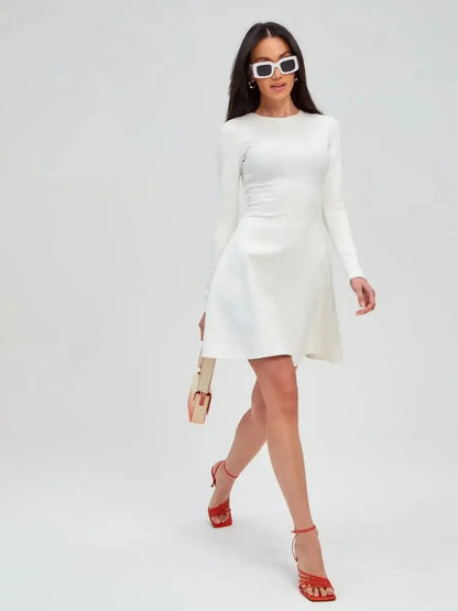 Model showcasing an elegant Ivory Sculpt Dress, perfect for weddings, proms, and summer events, paired with stylish accessories.
