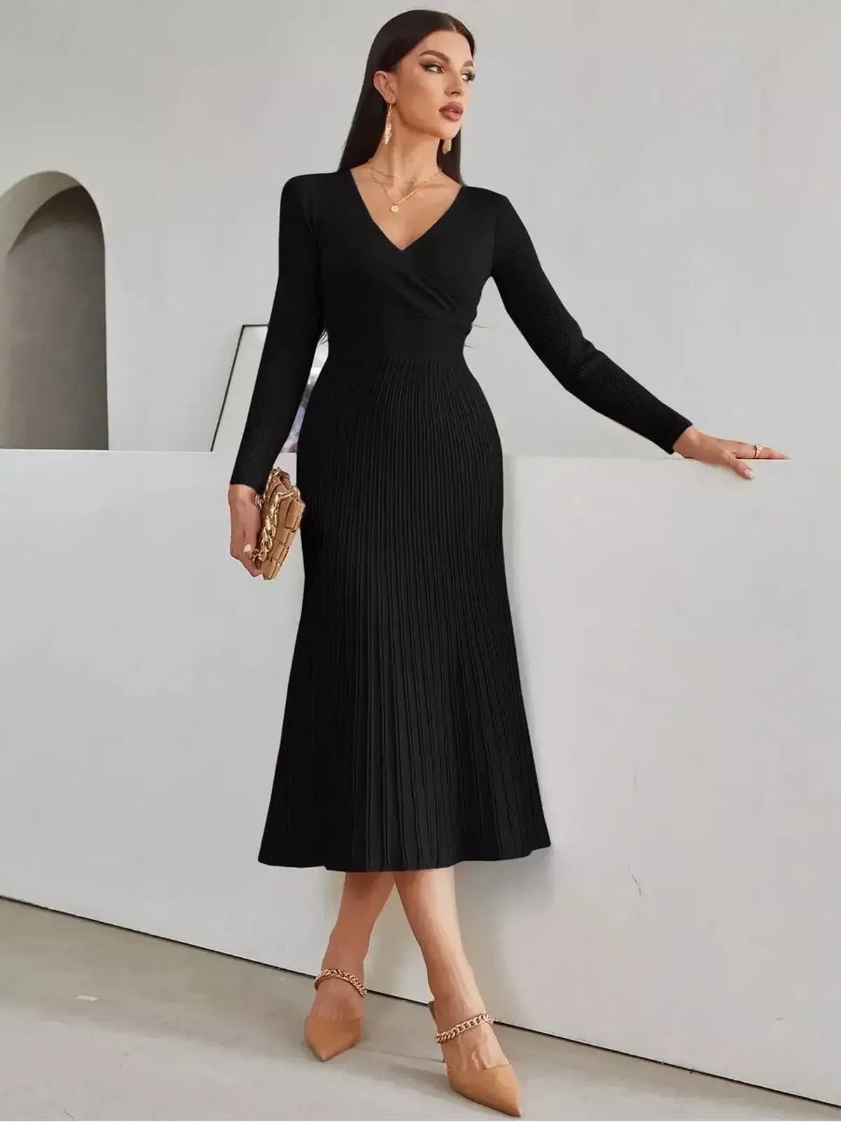 Sculpted Grace Midi Dress in black, featuring a fitted silhouette, ribbed texture, and elegant long sleeves for versatile occasions.