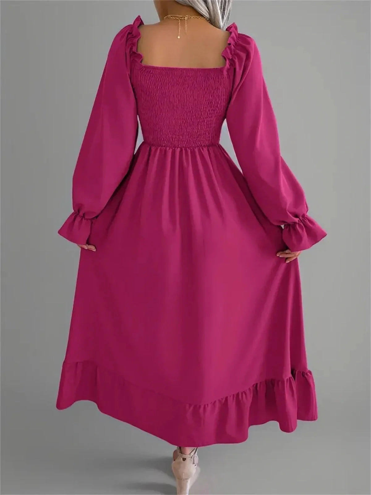 Roselle Midi Dress in bold magenta, featuring a smocked bodice and ruffled details, perfect for weddings and spring outings.